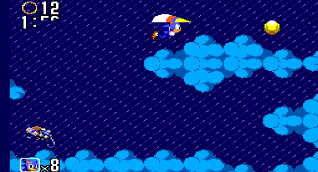 A screenshot of Sonic on a hang glider in the clouds, with a Chaos Emerald visible at the top of the screen