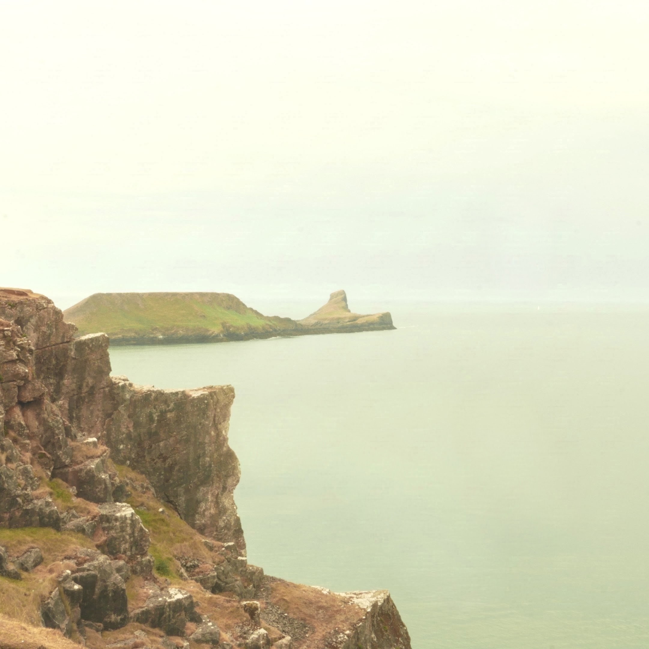 A peninsula shaped a bit like a long serpent with a protruding 'head' at the end.